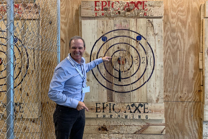 eric quinn at an ax throwing event