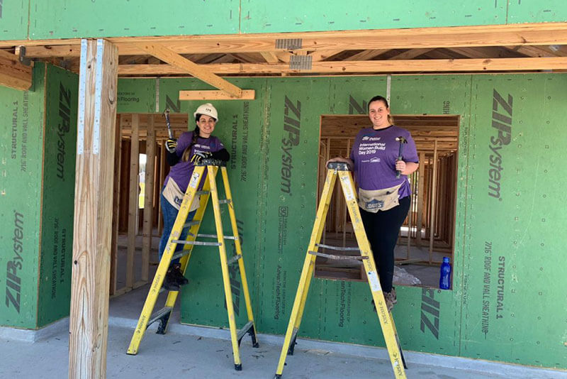 employees building on a habitat for humanity project